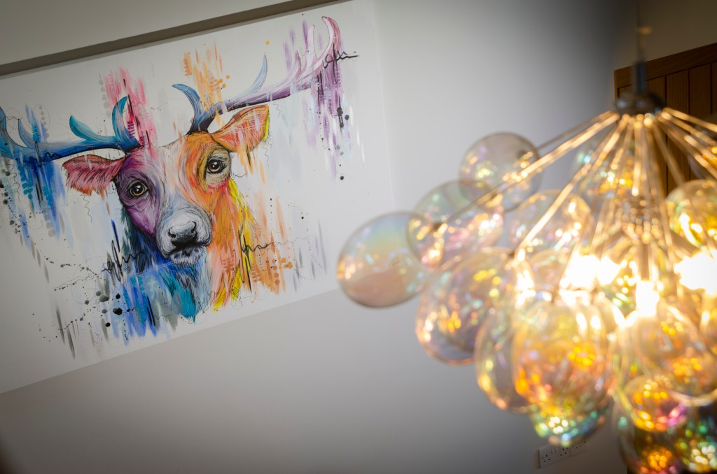 Skelwith Fold Greenhouse Intricate Lamp Detail with Colourful Stag Picture